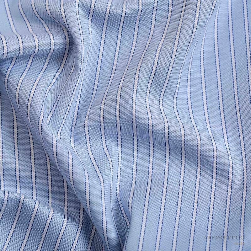 Blue and white pinstripe shirting fabric, draped macro detail