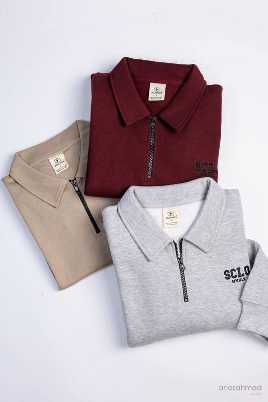 SCLOTHERS zip polo sweatshirts folded in maroon, grey and beige
