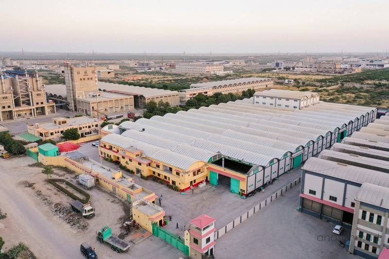 Aerial view of a large rice mill industrial complex and surrounding facilities