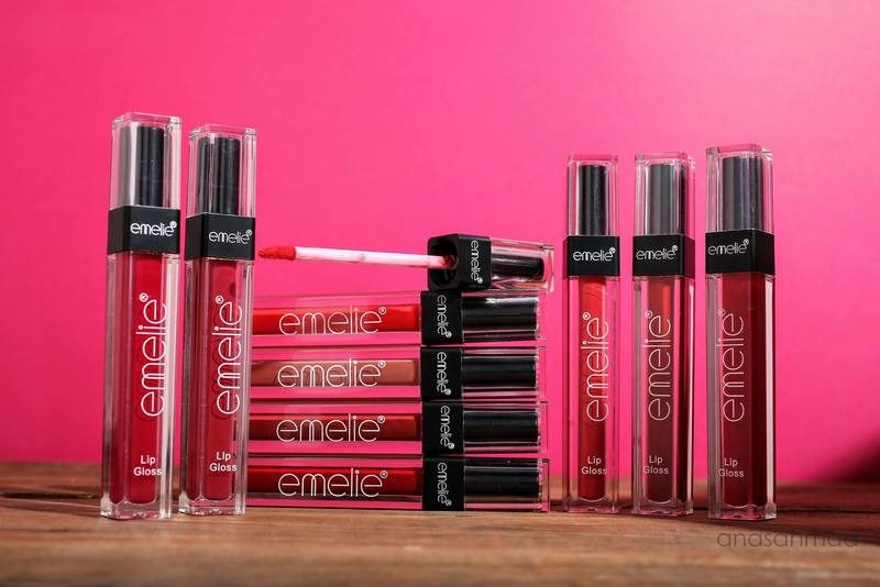 Emelie lip gloss collection in assorted shades on pink background