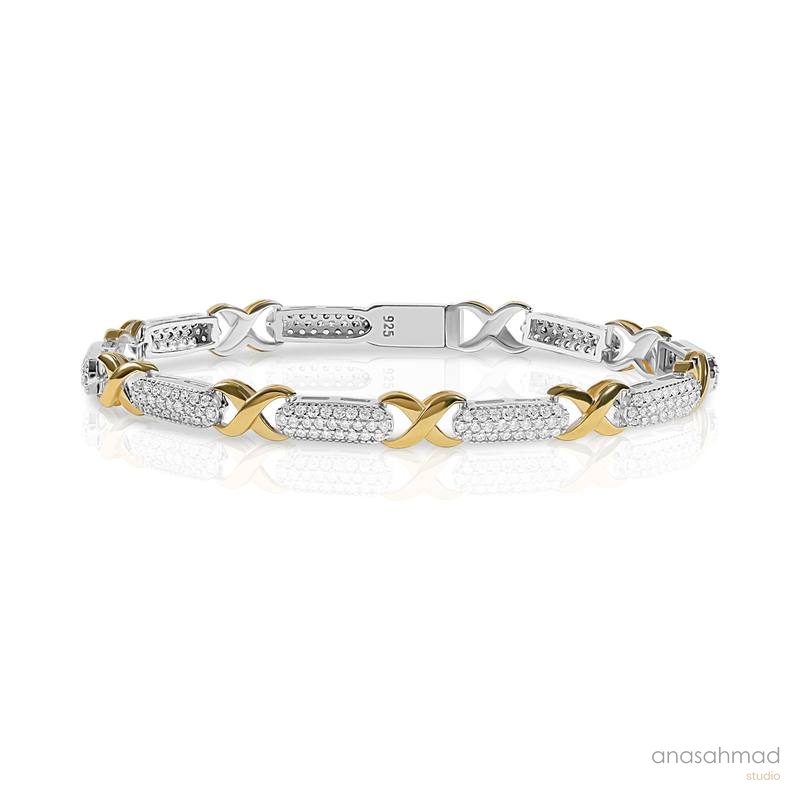 Two-tone gold and silver diamond tennis bracelet with X-link design