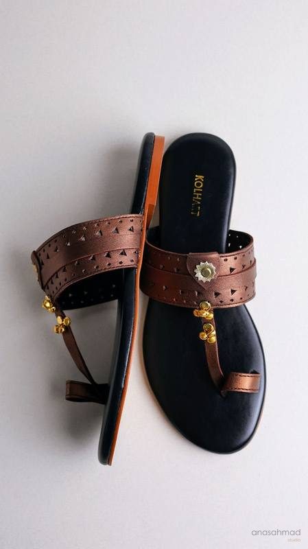 Bronze Kolhart leather sandals with gold bell charm detail
