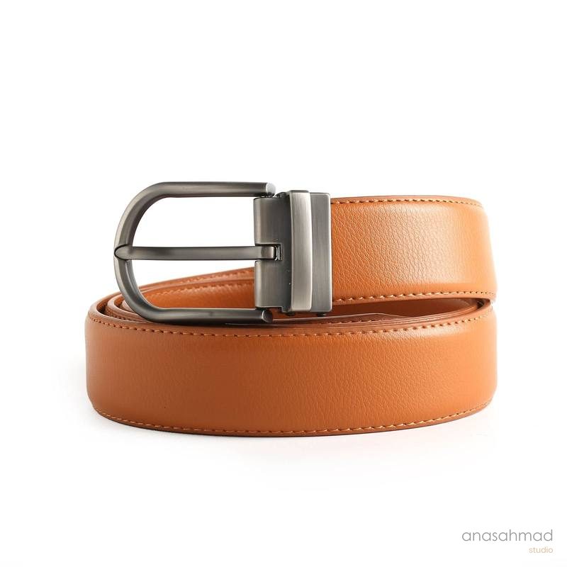 Tan leather belt with brushed metal automatic buckle, coiled