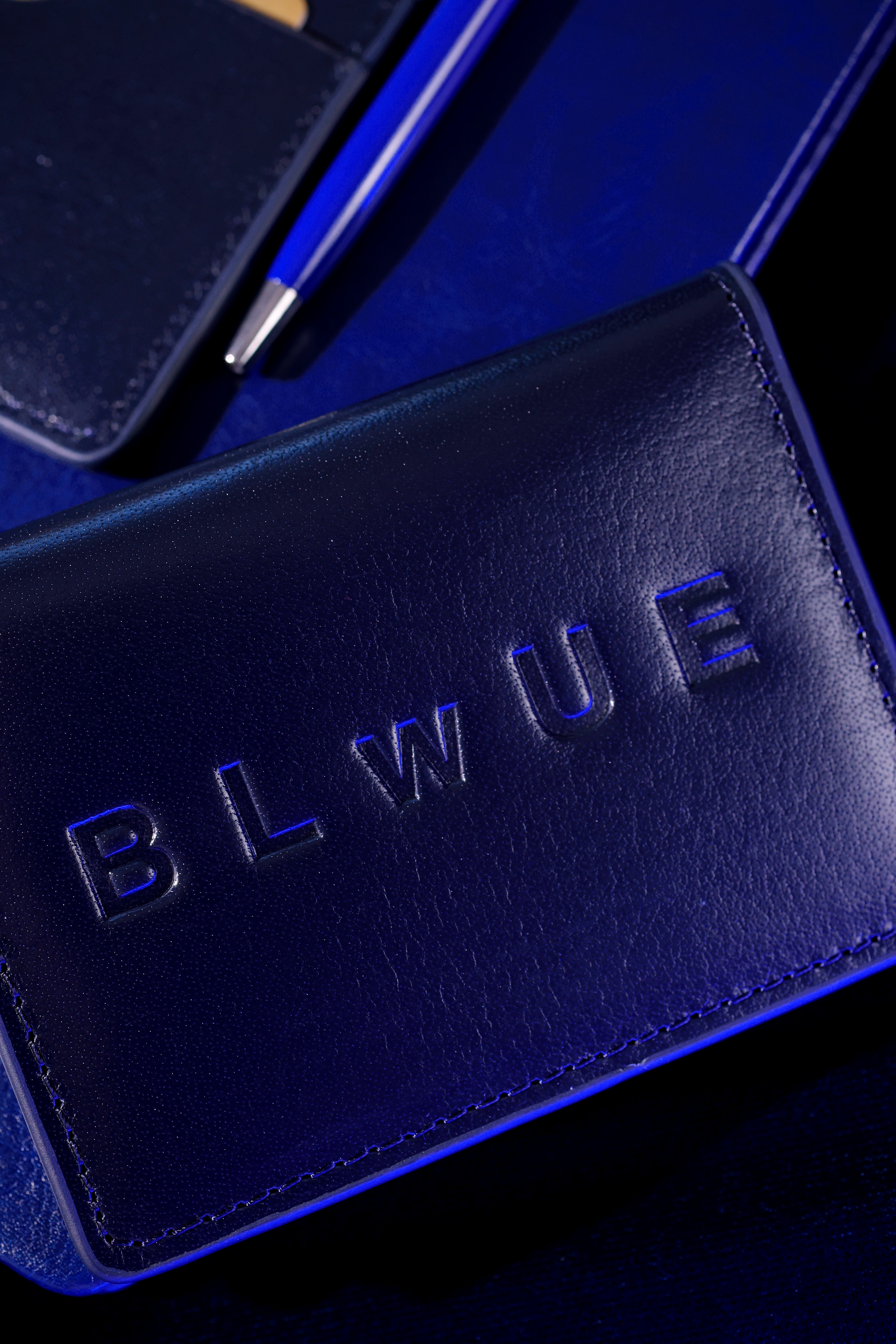 Premium blue leather wallet with embossed logo
