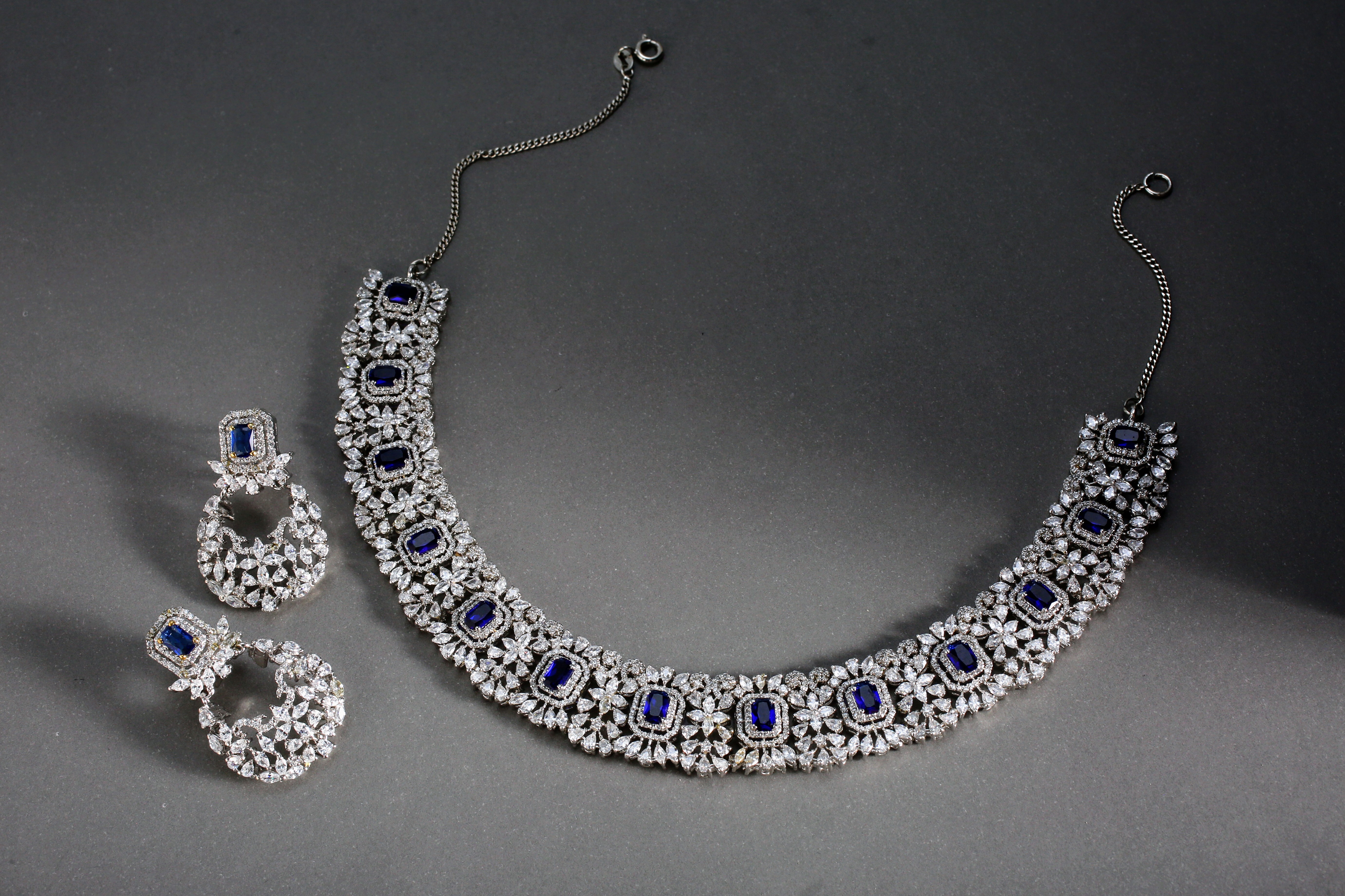 Luxury necklace with blue gemstones and diamond embellishments